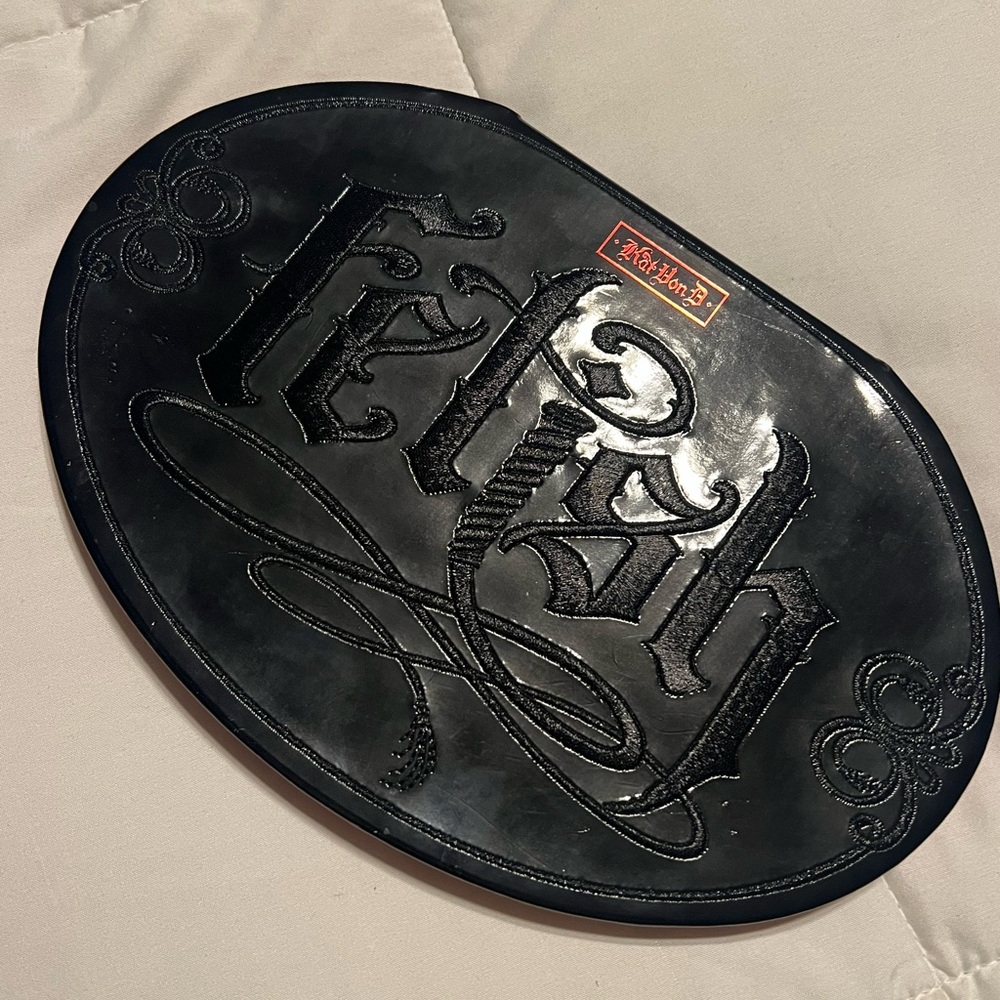 Black Oval Plaque with Embossed Design